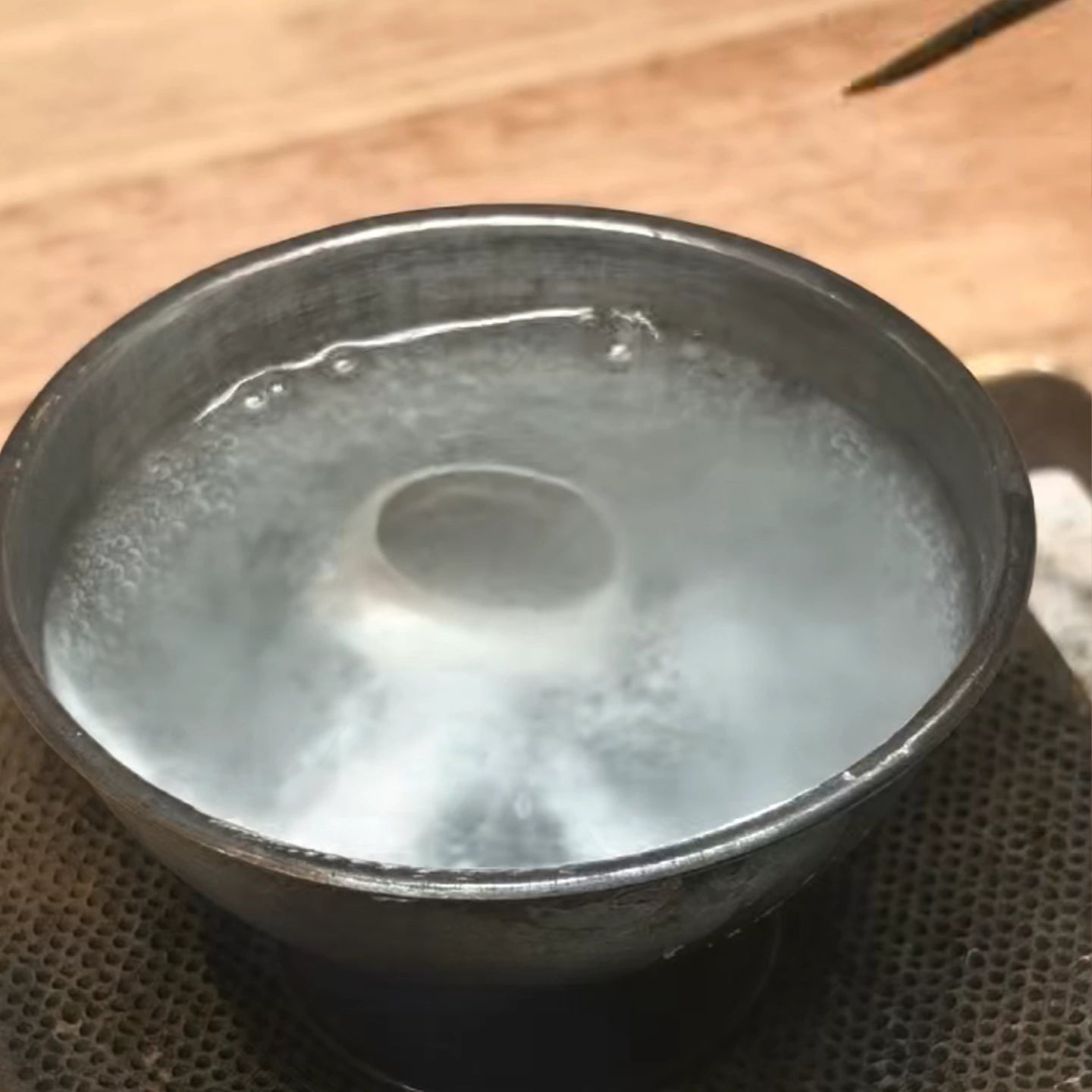 Acid boiling and pickling process of a 925 sterling silver owl ring for a pristine white heat finish.
