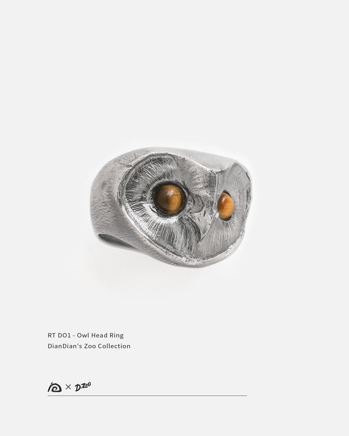 Hand-sculpted 925 sterling silver owl ring with natural tiger eye gemstone eyes, by Dzoo, available at Rainbow Tears.