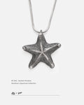 Front view of a distressed handcrafted silver starfish necklace designed by Dzoo, available at Rainbow Tears.