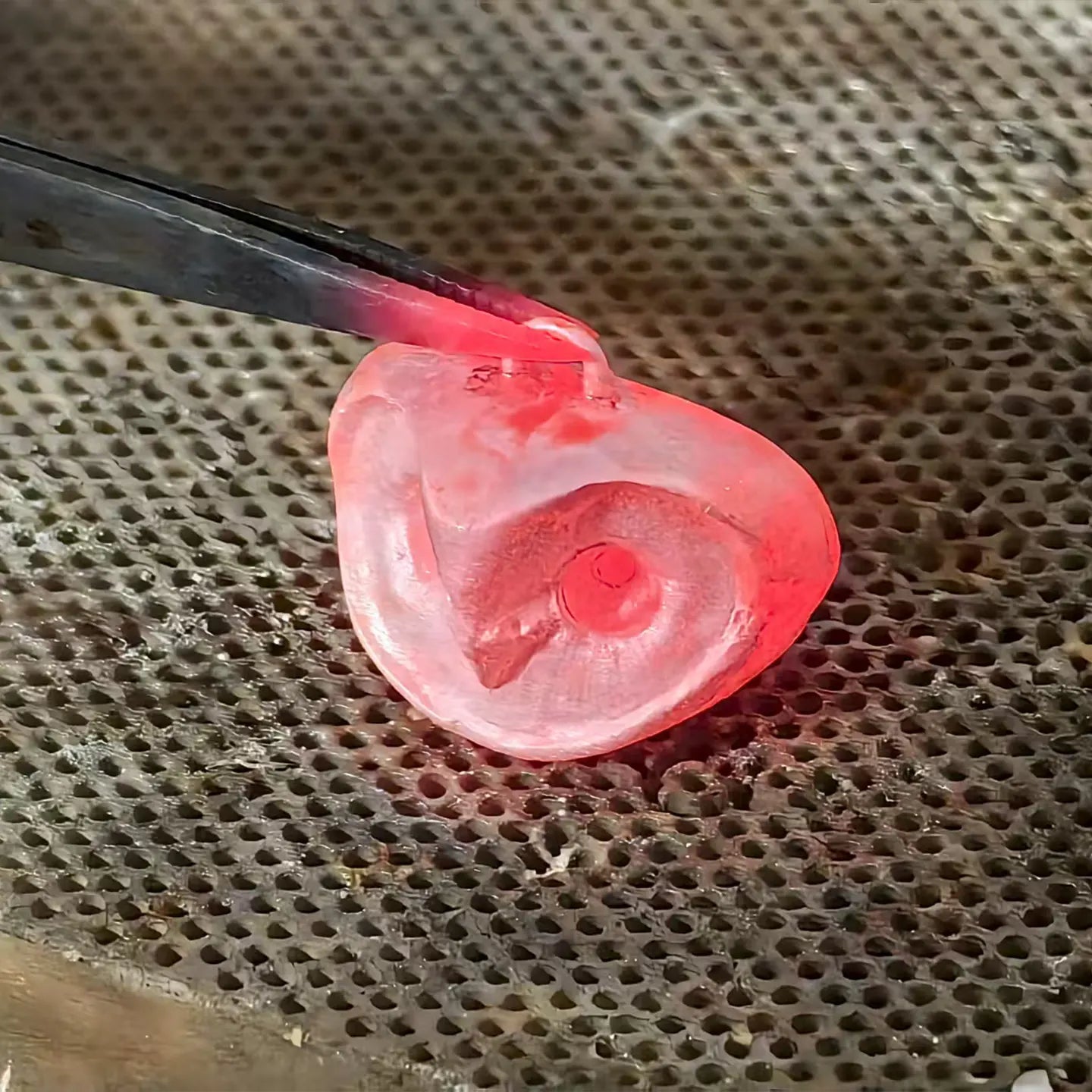 Jeweler soldering the bail onto a 925 sterling silver owl pendant, showcasing handcrafted designer jewelry making.