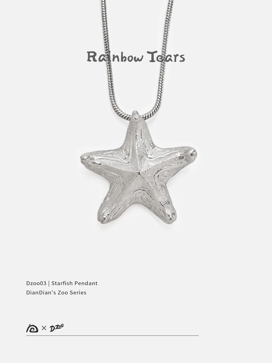 Front view of a bright handcrafted silver starfish pendant on a white background