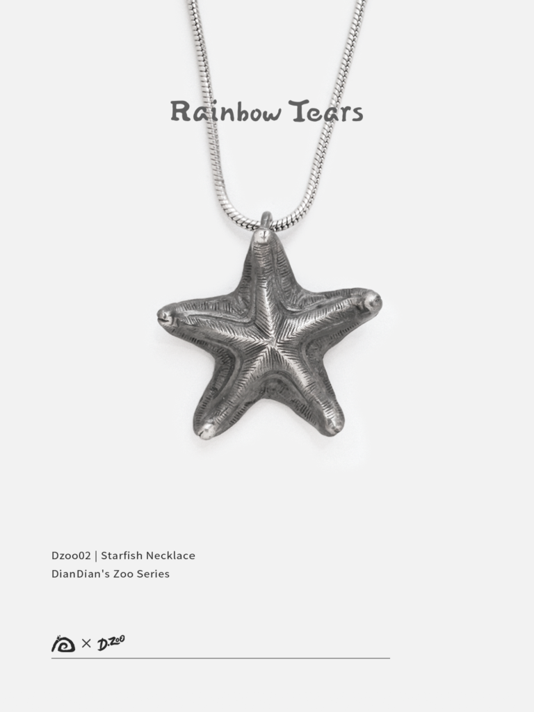 Front view of a distressed handcrafted silver starfish necklace on a white background
