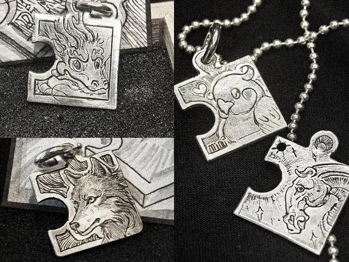 Four custom silver puzzle-piece pendants featuring an Eastern motif, a parrot, a wolf, and a horse design, representing Rainbow Tears' Unique Treasures artistic jewelry collection.
