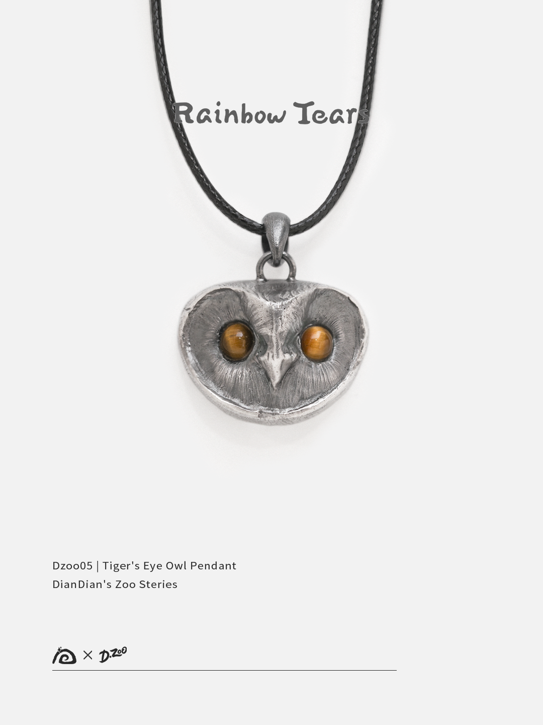 Front view of a sterling silver owl pendant with tiger's eye stone eyes on a white background