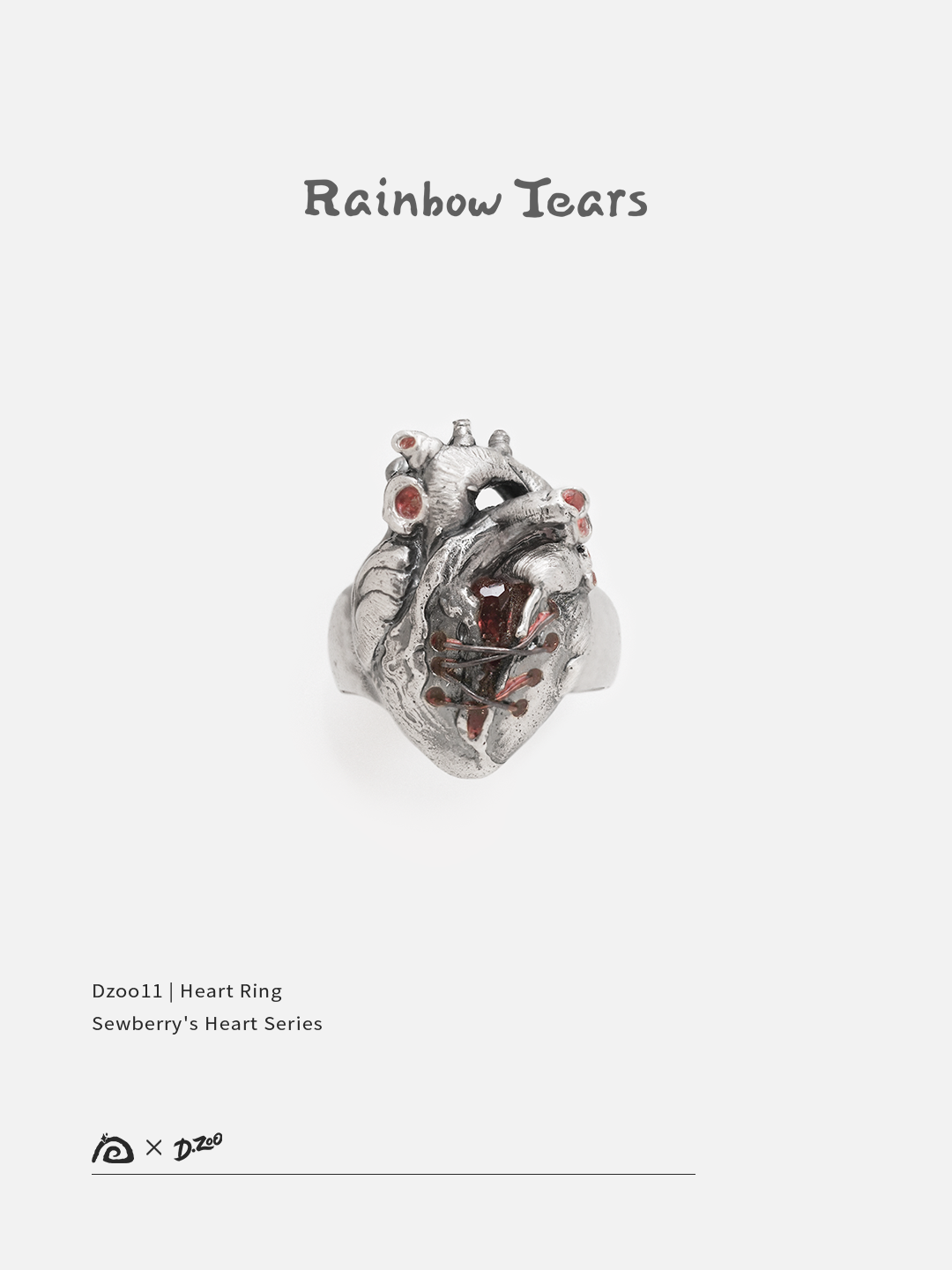 Front view of a silver heart ring set with red zircon on a white background