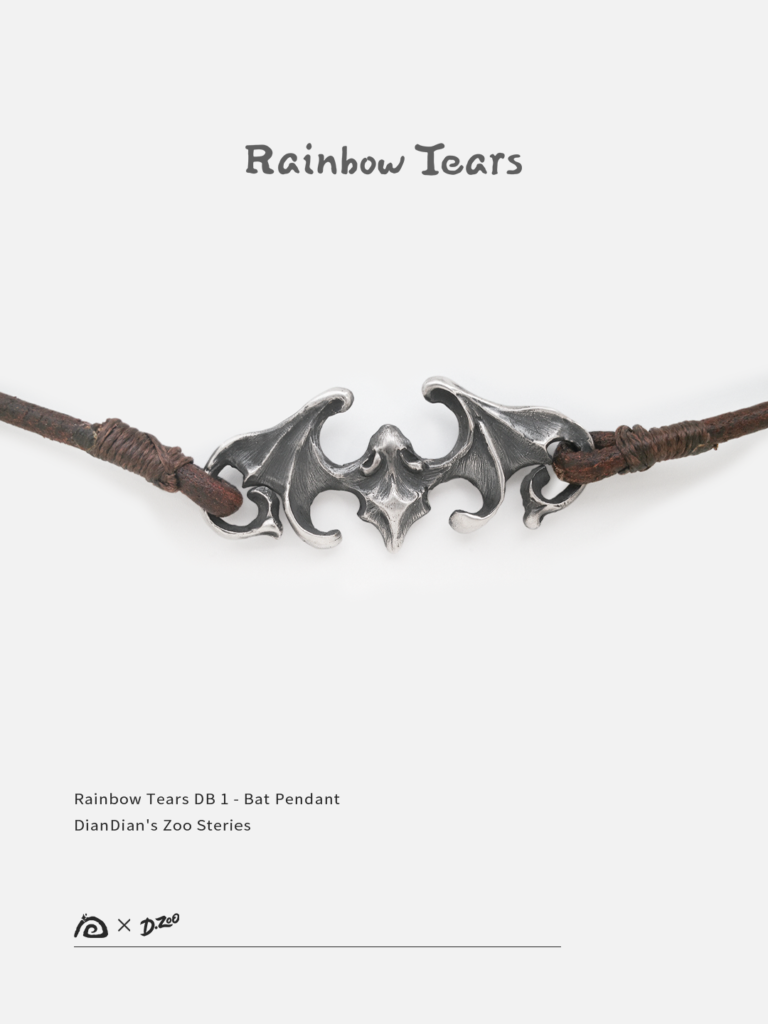 Front view of a sterling silver bat pendant on a white background