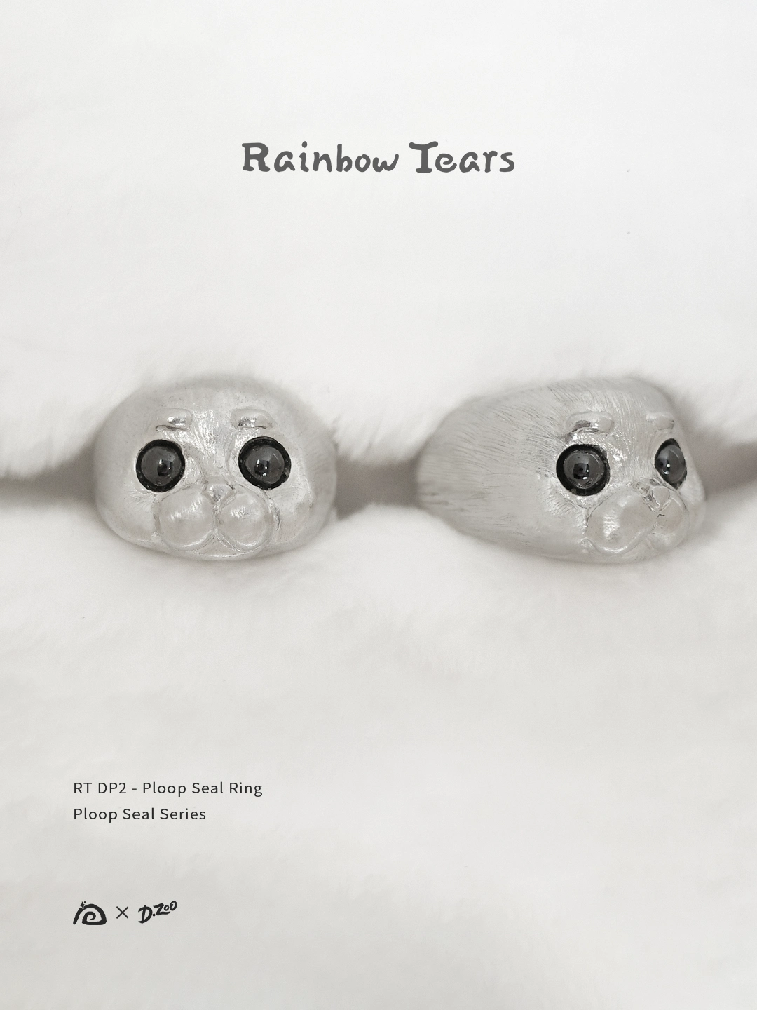 Front and 45-degree angle display of the pure silver Ploop seal ring placed on a white blanket