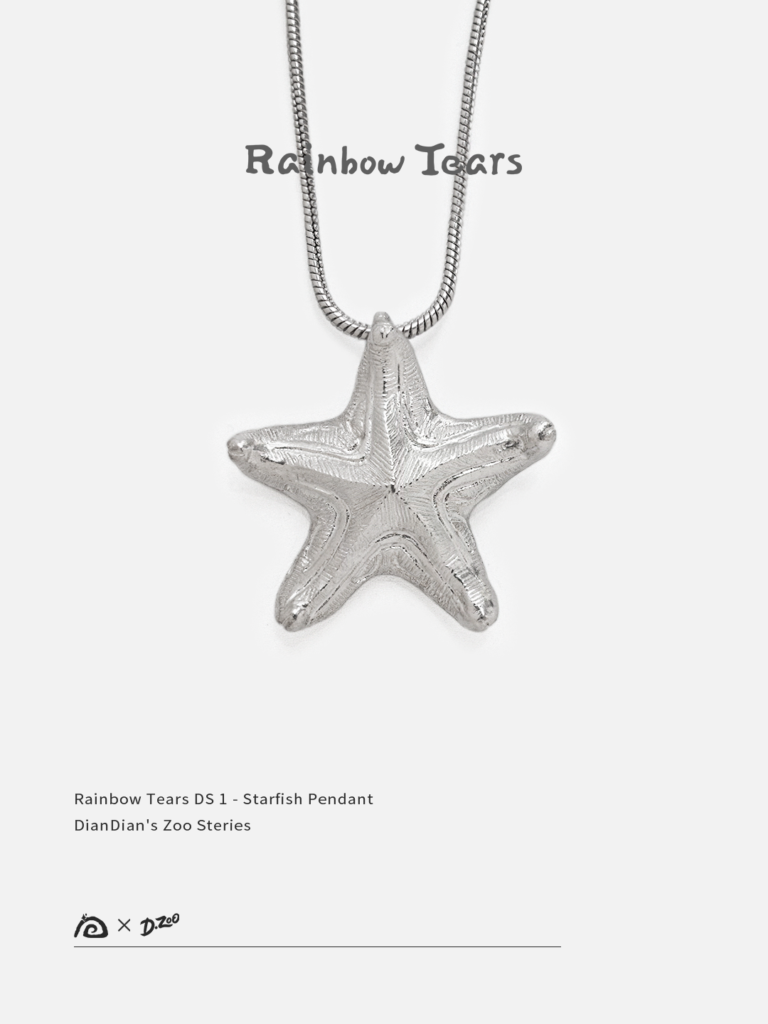 Front view of a bright handcrafted silver starfish pendant on a white background