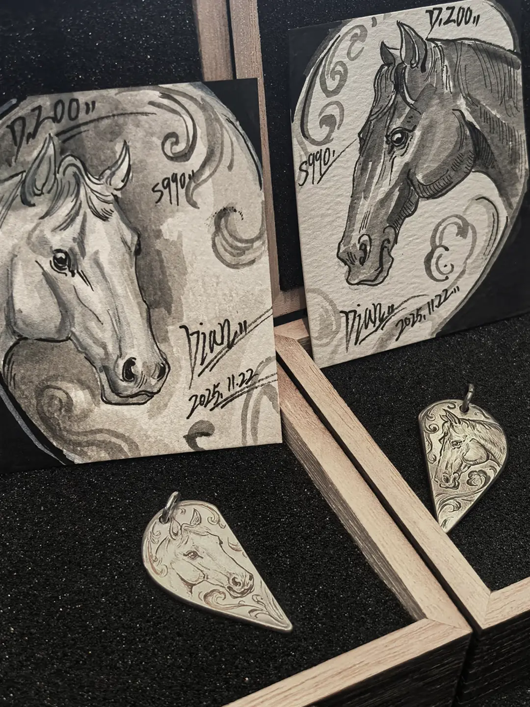 A pair of 990 fine silver half heart pendants with horse patterns, displayed alongside two exquisitely hand-painted horse art cards.