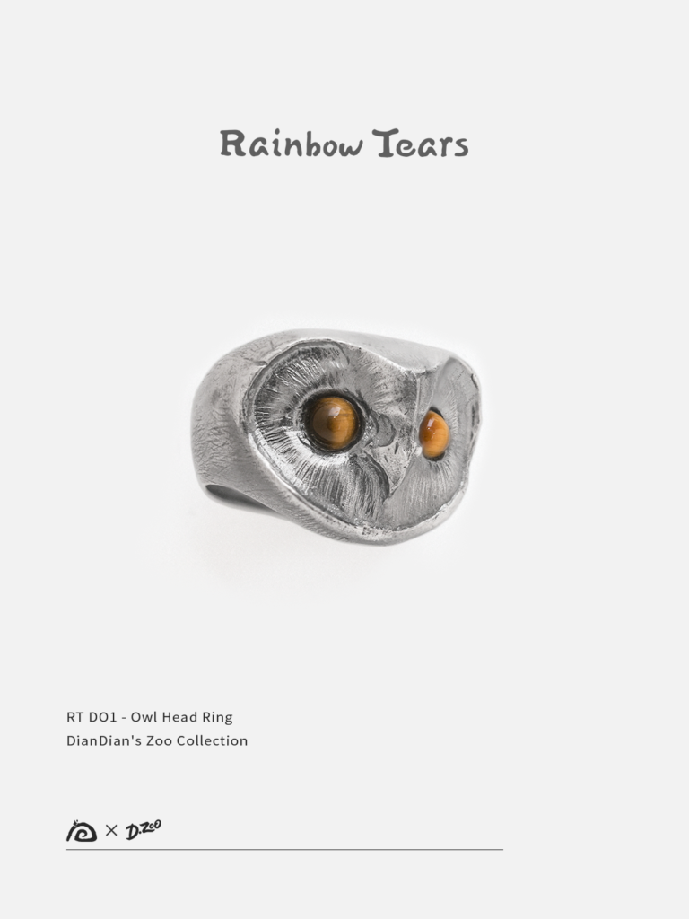 Hand-sculpted sterling silver owl head ring featuring two natural tiger eye stones as glowing eyes.