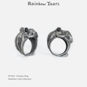 Sterling silver octopus ring shown from side and 45-degree angles, highlighting sculpted tentacle details