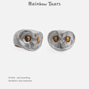 Front and 45-degree view of a sterling silver owl head ring with tiger's eye stones