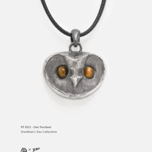 Front view of a sterling silver owl pendant with tiger's eye stone eyes on a white background