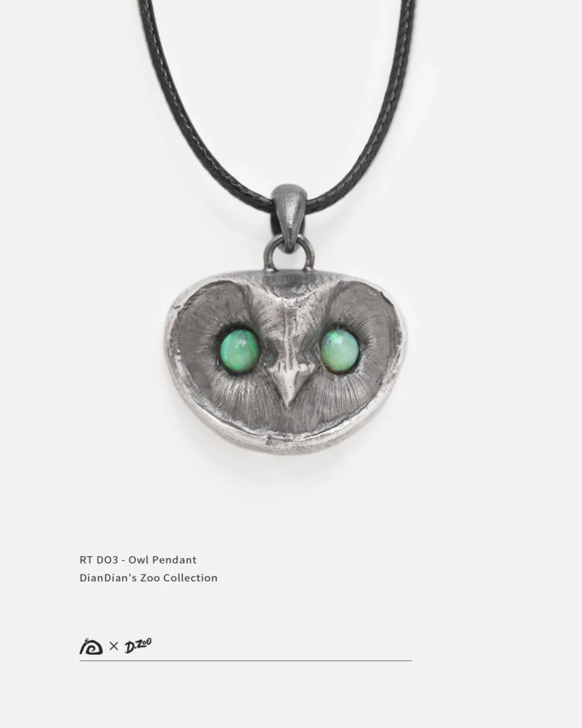 Handmade sterling silver owl pendant with an oxidized vintage finish, featuring two vibrant natural opal stones as the owl's eyes.