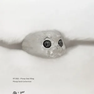 The pure silver Ploop seal ring is placed on a white blanket at a 45-degree angle.