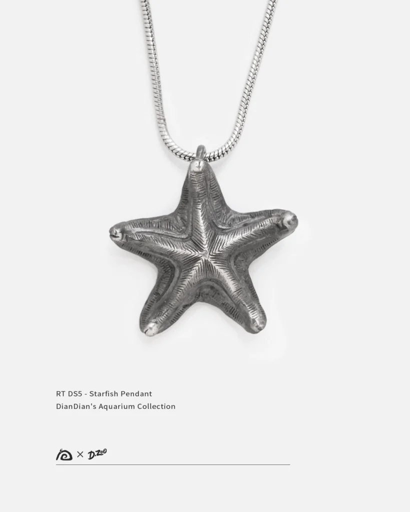 Front view of a distressed handcrafted silver starfish necklace on a white background