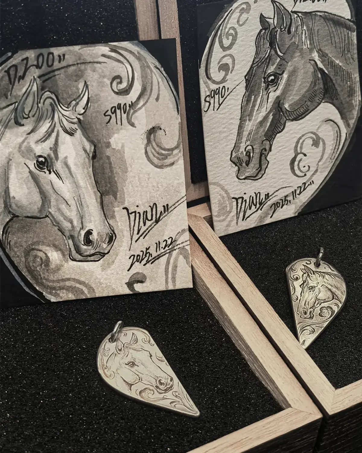 A pair of 990 fine silver half heart pendants with horse patterns, displayed alongside two exquisitely hand-painted horse art cards.