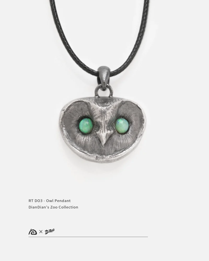Handmade sterling silver owl pendant with an oxidized vintage finish, featuring two vibrant natural opal stones as the owl's eyes.