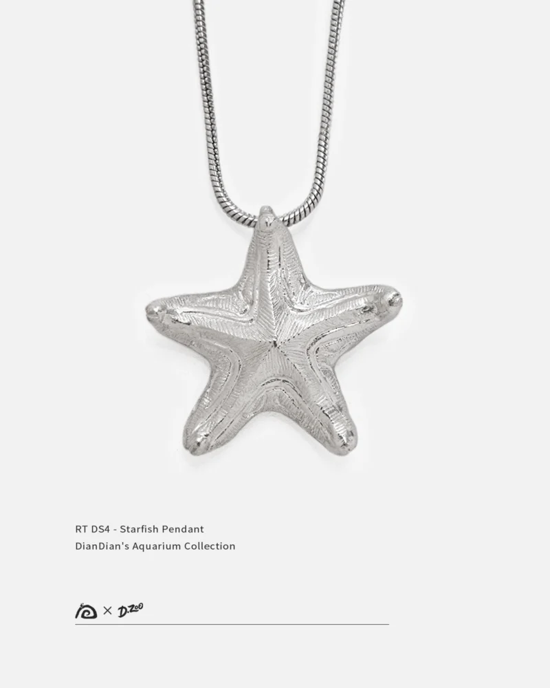 Front view of a bright handcrafted silver starfish pendant on a white background